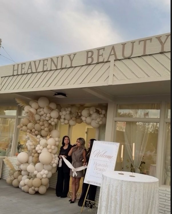 Heavenly Beauty Lounge storefront with balloon arch on grand opening day